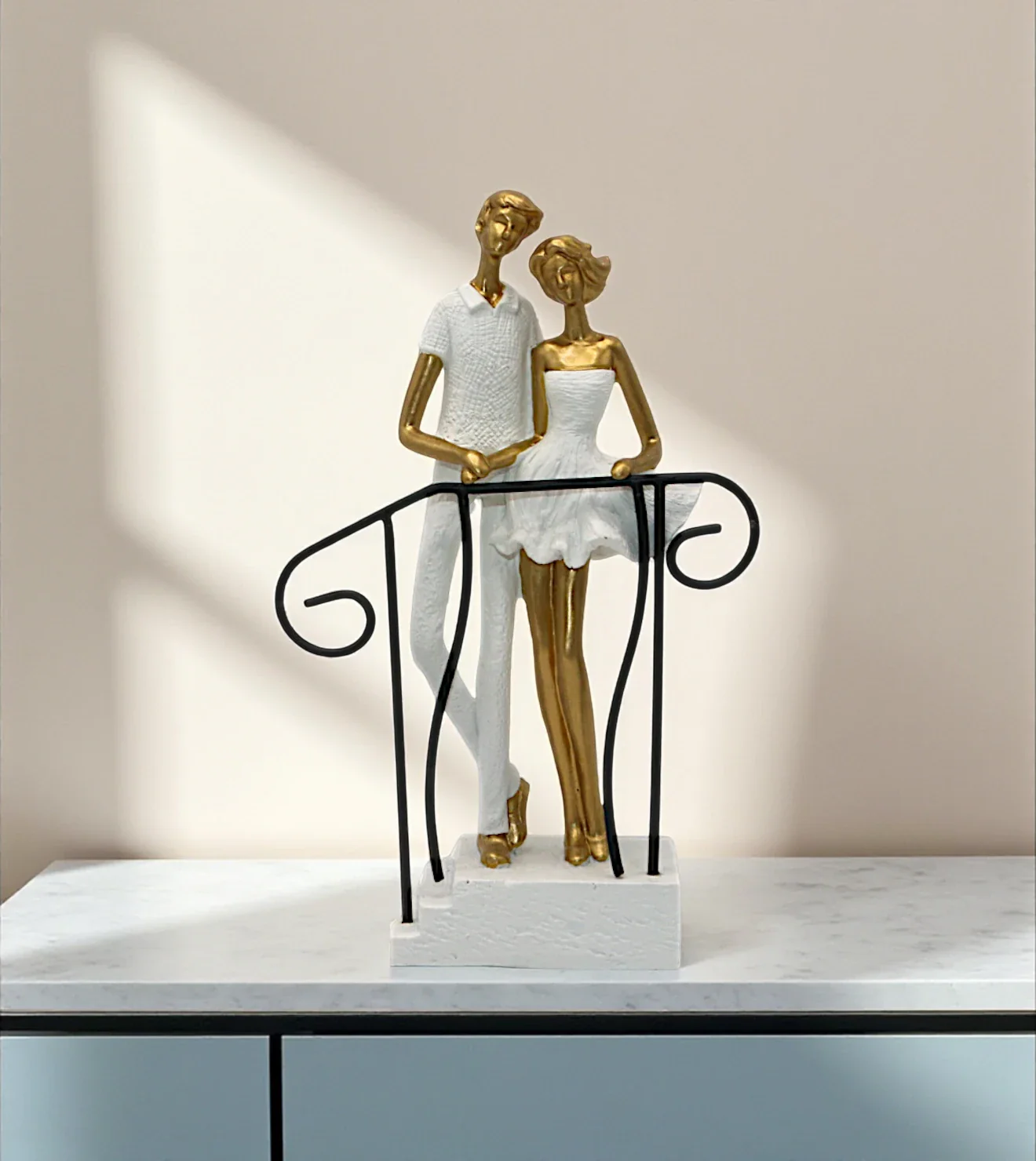 statue couple standing on stairs white china