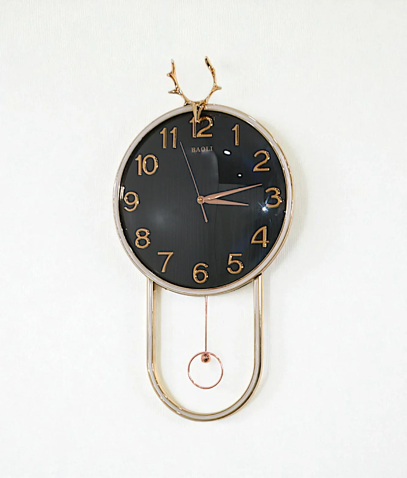 wall clock with golden deer & pendulum black china "25x15"